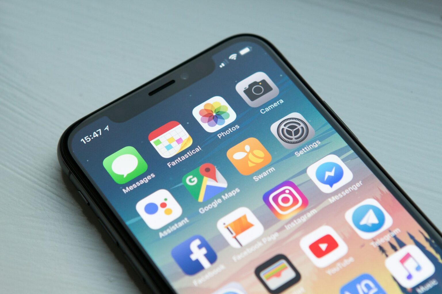 Smartphone home screen full of app icons